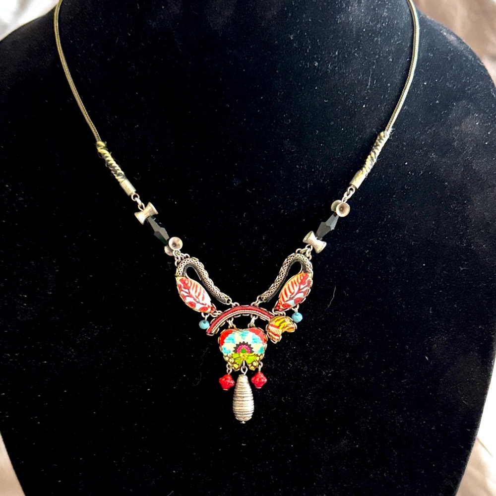 Fabulous unique necklace by V faceted glass with images under the glass V design